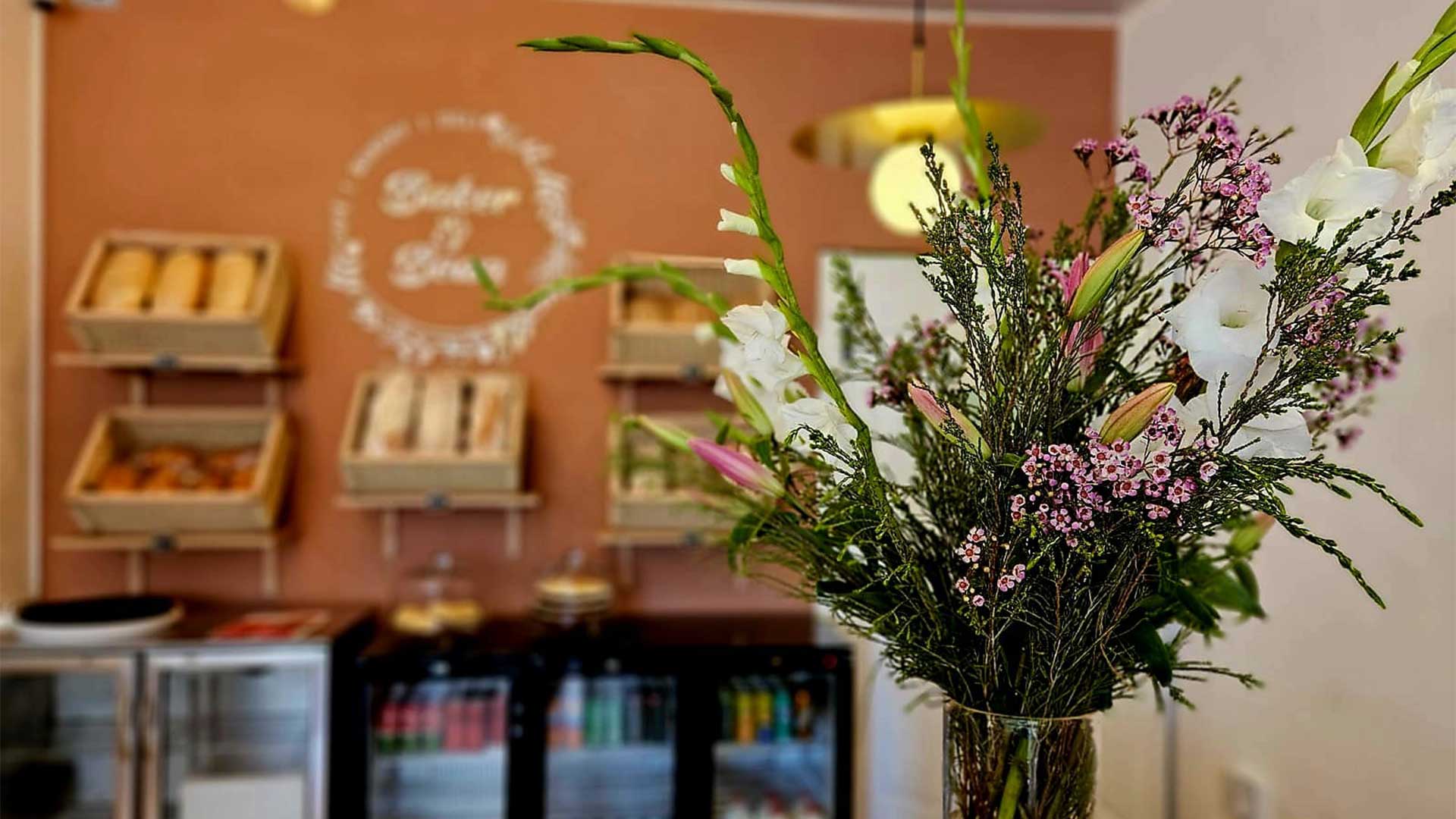 Fresh bread on the bakery shelves inside Baker & Bean café on St George's Street, Simon's Town